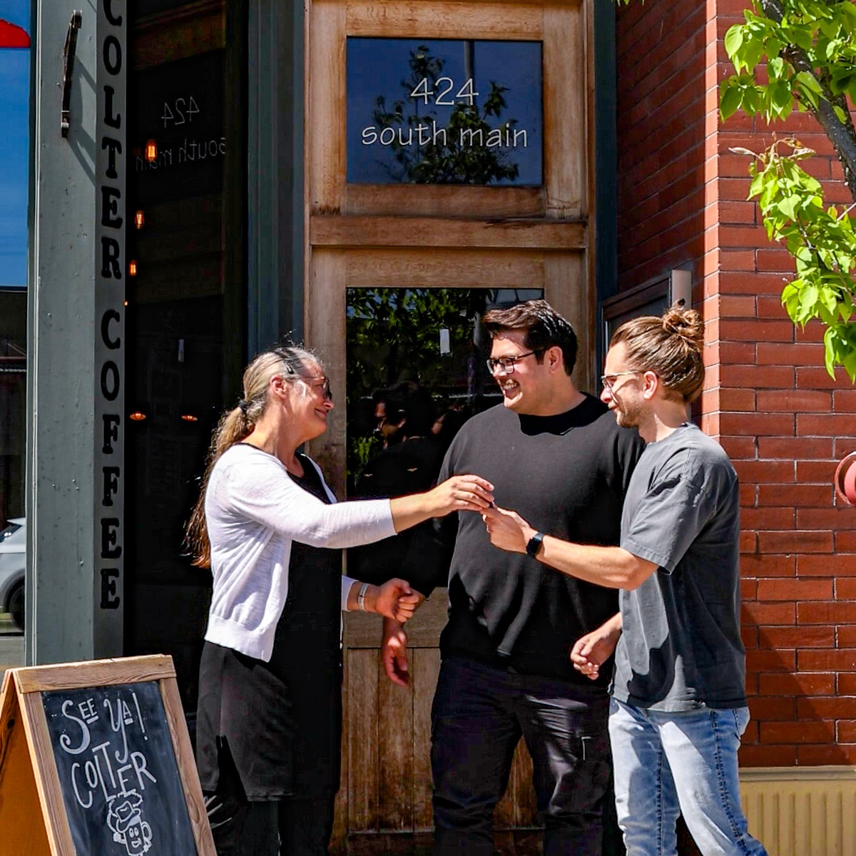 Alan Terry and Christian Cabrales, co-owners of Charro's Coffee House, standing together outside the shop on South Main in downtown Kalispell