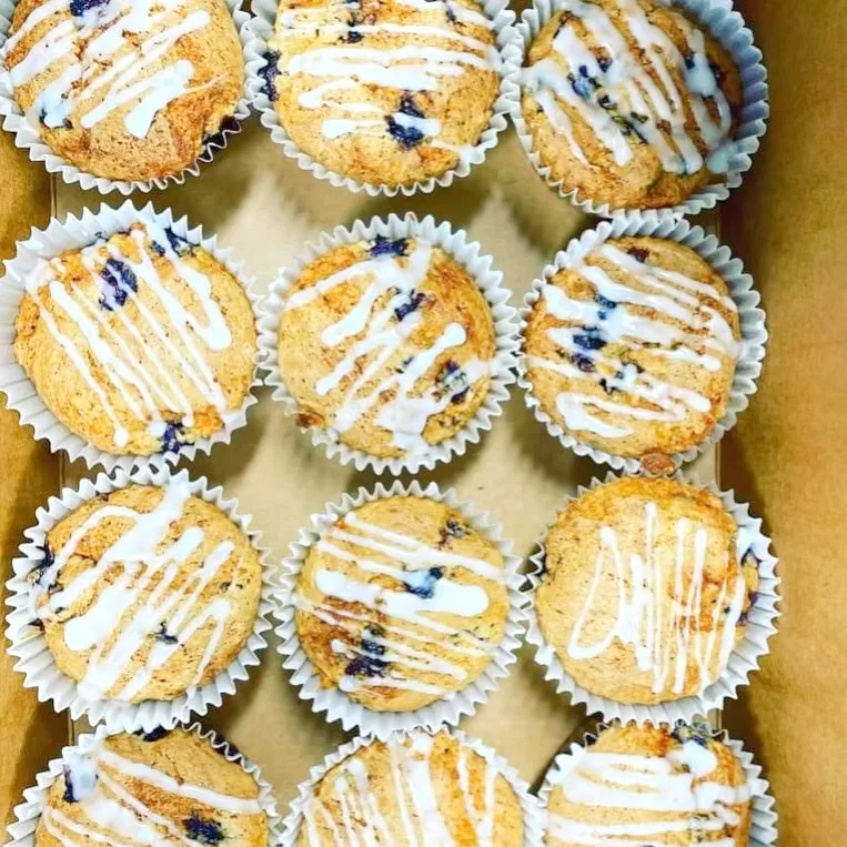 A tray of glazed gluten-free blueberry muffins from Red Poppy